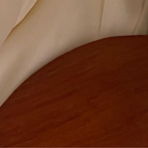 Off white winter jacket. Very stylish and cute with a faux fur trip on the hood